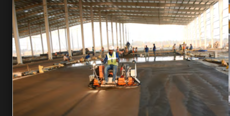 Finished concrete floor with ride-on trowel
