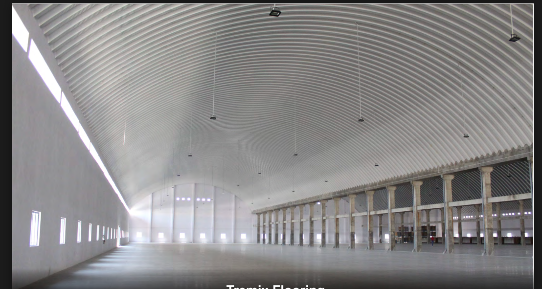 Vast Tremix flooring inside a curved-roof warehouse